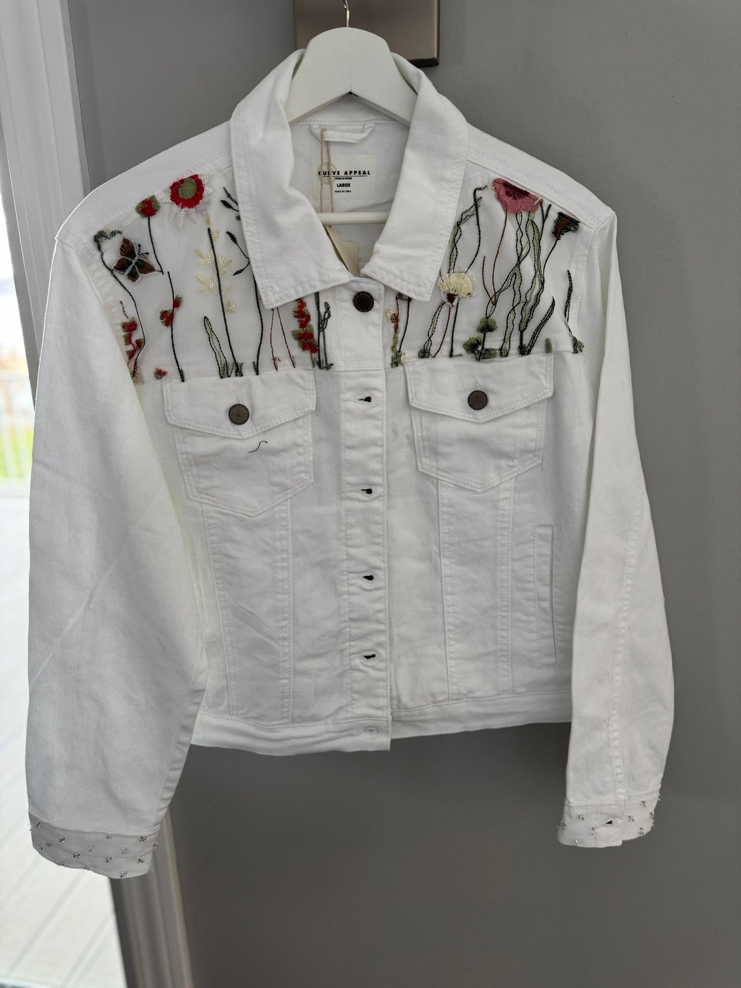 White jean jacket with appliqué